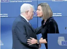  ?? EMMANUEL DUNAND/GETTY IMAGES ?? Palestinia­n President Mahmud Abbas, left, is welcomed by European Union foreign policy chief Federica Mogherini at the European Council in Brussels, Belgium, on Monday.