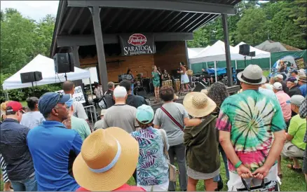  ?? LAUREN HALLIGAN - MEDIANEWS GROUP FILE ?? Fest-goers watching Jane Bunnett and Maqueque perform on the new gazebo stage at the 40th annual Freihofer’s Saratoga Jazz Festival in 2017 at Saratoga Performing Arts Center.