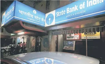  ??  ?? People line up outisde an ATM at a State Bank of India branch in Mumbai, India, in this file photo. India’s mutual funds are seeing a surge in stock investment­s from the hinterland as growing ranks of provincial retail investors help drive a two-year...