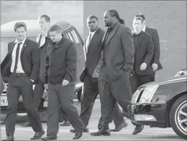  ??  ?? Kansas City Chiefs players and friends leave a memorial service for Jovan Belcher at the Landmark Internatio­nal Deliveranc­e
and Worship Center on Wednesday in Kansas City, Mo. Belcher shot his girlfriend and later turned the gun on himself.