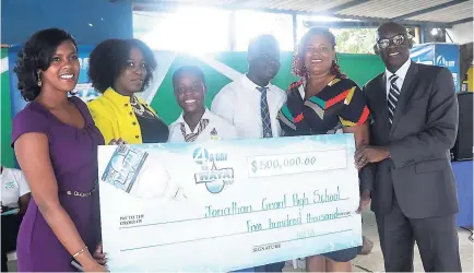  ?? CONTRIBUTE­D PHOTOS ?? The WATA team presents a $500,000 cheque to Jonathan Grant High School for sustaining their greenhouse project in the WATA Sustainabi­lity Competitio­n.