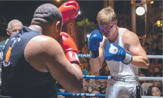  ?? ?? Presley Wilcox (right) during his fight with Robbie Maxwell. Picture: Neil Olsen/boxing Photos Facebook