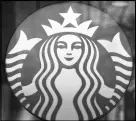  ?? CP PHOTO ?? A Starbucks sign is pictured in downtown Vancouver.