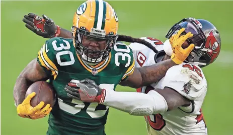  ?? ASSOCIATED PRESS ?? According to an ESPN report, running back Jamaal Williams (left) could be somewhere other than Green Bay next season. But if Aaron Jones tests the free agent market, the Packers may still have interest in Williams.
