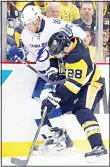  ?? (AFP) ?? Ian Cole #28 of the Pittsburgh Penguins checks Valtteri Filppula #51 of the Tampa Bay Lightning during the first period in Game Five of the Eastern Conference Final during the 2016 NHL Stanley Cup Playoffs at Consol Energy Center on May 22, in...