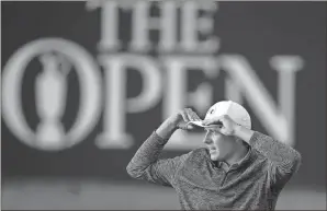  ?? Dave Thompson / The Associated Press ?? Jordan Spieth walks off the 18th green after finishing the third round of the British Open at Royal Birkdale on Saturday. Spieth leads Matt Kuchar by three strokes.