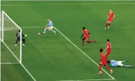  ?? Photograph: Jan Kruger/UEFA/Getty Images ?? Erling Haaland slots the ball past Yann Sommer to put Manchester City 3-0 ahead of Bayern Munich.