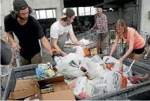  ?? PHOTO: WARWICK SMITH/STUFF ?? Helpers rally to sort donated food at the Palmerston North Annual Food Drive.