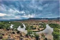  ?? SUSAN MONTOYA BRYAN/ASSOCIATED PRESS FILE PHOTO ?? A bend in the Rio Chama near Abiquiú. Traditiona­l irrigation systems known as acequias that depend on the river are feeling more pressure as drought persists.