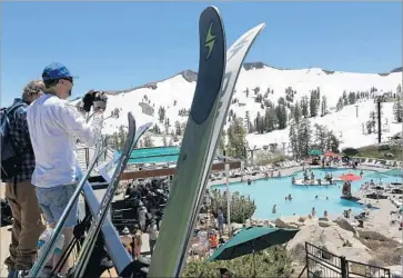  ?? Photograph­s by Gary Coronado Los Angeles Times ?? EVEN WITH daytime highs now cresting above 70, the crews at Squaw Valley Ski Resort expect to be able to groom and tend ski runs past July 4, pushing snow around to fill in patches worn thin by the heavy traffic.
