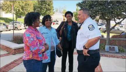  ?? DIGITAL FIRST MEDIA FILE PHOTO ?? Lt. Bob Greenaway of the Norristown Police Department welcomes, from left, Sharon Brooks, Katrina Cheek and Janine Mitchell to Coffee With a Cop outside of municipal hall in this file photo from Oct. 7, 2016.