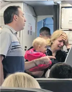  ??  ?? American Airlines is looking into whether one of its male flight attendants violently took away a stroller from this female passenger on a Friday flight.