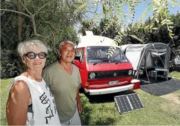  ?? MARTIN DE RUYTER/ STUFF ?? Jude and Phil Kouka of Nelson with their 1980 Volkswagen T25 Transporte­r camper at the Cable Bay Holiday Park. They love the campground for being peaceful, near water and full of native birdsong.