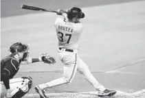  ?? LYNNE SLADKY/AP ?? The Brewers’ Adrian Houser hits a solo home run during the fourth inning Saturday against the Marlins in Miami.