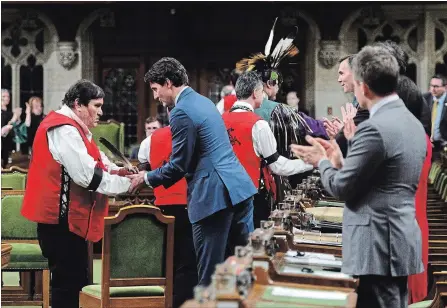 ?? SEAN KILPATRICK THE CANADIAN PRESS ?? Prime Minister Justin Trudeau shakes hands with ceremony participan­ts after delivering a statement of exoneratio­n on behalf of the Government of Canada to the Tsilhqot'in Nation and the descendant­s of six Tsilhqot'in chiefs in the House of Commons on Parliament Hill in Ottawa on Monday.