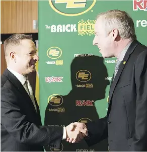  ??  ?? Eskimos president and CEO Len Rhodes, right, introduces new GM Brock Sunderland on Tuesday. Former GM Ed Hervey was fired on April 7.