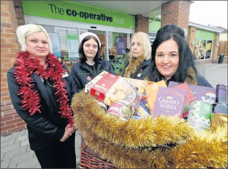  ??  ?? The launch of Pamper with a Hamper 2017 with The co-operative Food and The Hinckley Times Christmas hampers. Pictured left to right Fi Fletcher (sales assistant), Lorraine Dunkley (supervisor), Emma O’Toole (sales assistant), Hayley Langdale (supervisor)