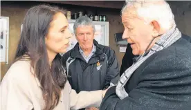  ?? Picture / Claire Trevett ?? West Coast MP Damian O’Connor watches on as Jacinda Ardern chats with Bernie Monk, who says Ardern has his support.
