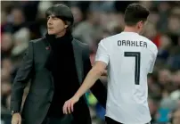  ?? AP ?? German coach Joachim Loew has a word with Julian Draxler after he was substitute­d in the friendly match against England. —