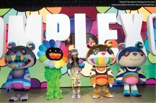  ??  ?? Takashi Murakami flanked by his own mascots before the first day of ComplexCon.