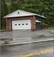  ?? PHOTO PROVIDED-TOWN OF BALLSTON ?? The Burnt Hills Fire Department built a new firehouse across from Town Hall but their old firehouse, shown here, on the corner of Charlton Road and Scotchbush Road might be repurposed for a sheriff’s substation.