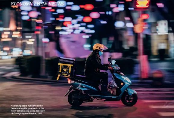  ??  ?? As many people hunker down at home during the pandemic, a delivery driver races along the street of Chongqing on March 4, 2020.