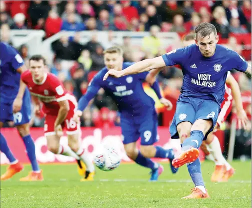  ??  ?? NO MISTAKE: Joe Ralls scores the winning goal for Cardiff from the penalty spot