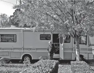  ?? JASON HENRY/THE NEW YORK TIMES ?? Russel Lee poses Tuesday in front of the RV he has been living out of since he lost his home in the Tubbs Fire, in Santa Rosa, Calif. For many California­ns, natural disasters are a moment to take stock and rethink the dream of living there, but in the...