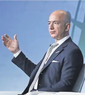  ??  ?? Amazon founder Jeff Bezos, who also owns The Washington Post, is the world’s richest person. MARK WILSON/GETTY IMAGES