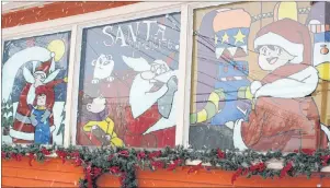  ?? MILLICENT MCKAY/JOURNAL PIONEER ?? “Santa’s Apprentice” painted on the Winchester’s front windows.