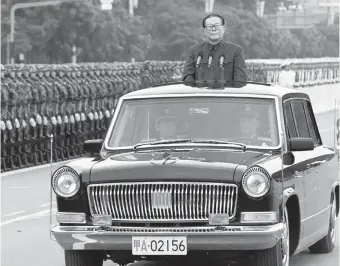  ?? ?? Jiang Zemin inspects the grand parade for the 50th anniversar­y of the founding of the People’s Republic of China at Beijing’s Tian’anmen Square on October 1, 1999.