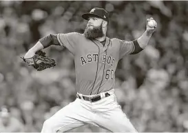  ?? Elizabeth Conley / Houston Chronicle ?? Astros lefthander Dallas Keuchel delivers another strong start Friday, shutting out the Athletics over seven innings while striking out three and walking one.