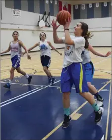  ?? KEVIN ADSHADE/THE NEWS ?? LEFT: Jaden MacEachern guards Raegan MacDonald during a team drill. RIGHT: Courtney Smith goes in for a shot at an NNEC Gryphons practice this week.