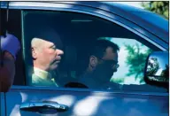  ?? Freddy Monares/AP ?? Facing trouble: Republican candidate for Montana's only U.S. House seat, Greg Gianforte, sits in a vehicle near a Discovery Drive building on Wednesday in Bozeman, Mont. A reporter said Gianforte "body-slammed" him Wednesday, the day before the special...