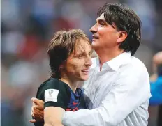  ?? AP ?? Croatia’s Luka Modric celebrates with coach Zlatko Dalic during the semi-final match in the Luzhniki Stadium.