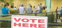  ?? FILE ?? Voters wait in line for polls to open at the Oakland Park Library on Election Day on Nov. 8, 2022. A new bill passed by the Florida Legislatur­e would require registerin­g with a state ID, potentiall­y making it difficult for new residents to vote.