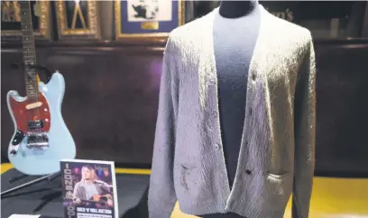  ?? Pictures: AFP ?? REPURPOSED. Kurt Cobain’s cardigan from Nirvana’s 1993 MTV Unplugged performanc­e on display at the Hard Rock Cafe in New York City, ahead of a 2019 auction. It fetched about R2.6 million.