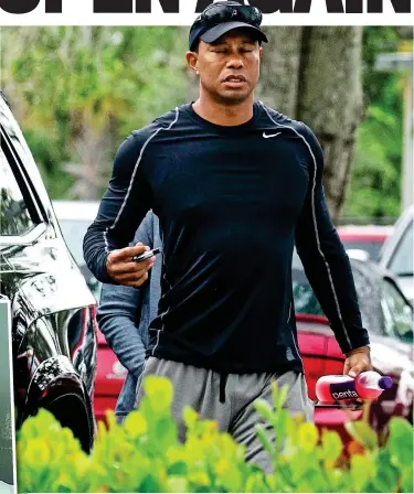  ?? SPLASH NEWS ?? Troubled times: Woods visits the Jupiter Medical Centre in Florida, the first time he has been seen in public since police arrested him (left) last Monday