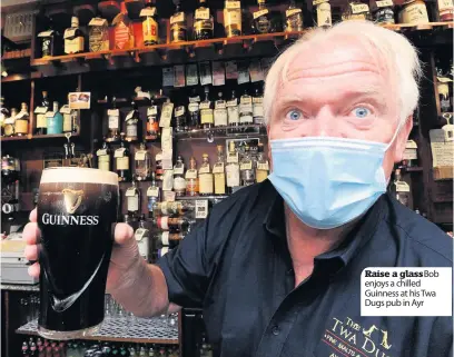  ??  ?? Raise a glassBob enjoys a chilled Guinness at his Twa Dugs pub in Ayr