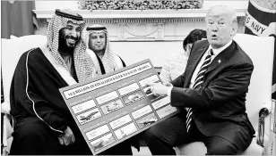  ?? EVAN VUCCI THE ASSOCIATED PRESS ?? President Donald Trump, above, holds a chart highlighti­ng arms sales to Saudi Arabia during a meeting with Saudi Crown Prince Mohammed bin Salman, left. The young prince will brook no dissent in reshaping the kingdom in his image.