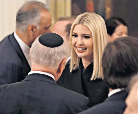  ??  ?? Ivanka Trump, the US president’s daughter and senior adviser, greets guests arriving at the White House for the announceme­nt of her father’s proposals for the Middle East
