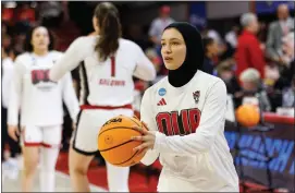  ?? AP PHOTO/BEN MCKEOWN ?? North Carolina State’s Jannah Eissa warms up prior to a second-round college basketball game against Tennessee in the NCAA Tournament in Raleigh, N.C., Monday, March 25, 2024.