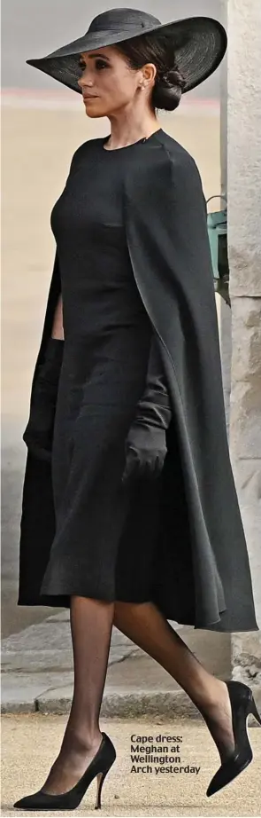  ?? ?? Cape dress: Meghan at Wellington Arch yesterday