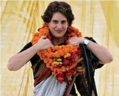  ?? —Reuters file photo ?? Priyanka Gandhi adjusts her flower garlands as she campaigns during an election meeting at Rae Bareli in Uttar Pradesh on April 22, 2014.