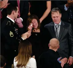 ?? TOM BRENNER / THE NEW YORK TIMES ?? Cindy and Fred Warmbier, the parents of Otto Warmbier, are applauded as they attend the State of the Union address in 2018. The Warmbier family spoke out Friday about Trump’s refusal to blame North Korean leader Kim Jong Un for the death of their son.