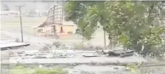  ?? JASH RAM VIA REUTERS ?? Nature’s fury . . . The roof of a temple is blown off as strong winds rage through Sigatoka, Viti Levu, as Cyclone Harold batters Fiji yesterday.