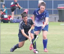  ??  ?? IN A TANGLE: Erin Alexander of Yanac Women shapes to clear the ball despite an attempt by Kaniva’s Jules Braisby. Picture: SIMON KING
