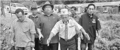  ??  ?? Tuai Rumah Seliong (second right) welcomes Nanta (third right) and Jamit (second left) to his longhouse at Sungai Belawai. At left is Cr George Tang.