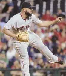  ?? AP PHOTO ?? CLOSING ARGUMENT: Reliever Robby Scott fires a pitch in the ninth inning of the Red Sox’ 7-3 win last night.