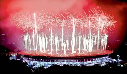  ?? — AFP ?? Fireworks explode over the Gelora Bung Karno Stadium at the closing ceremony of the Asian Games in Jakarta on Sunday.
